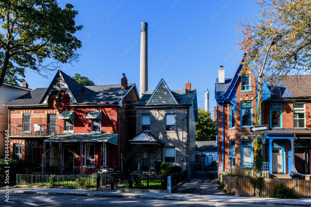 Fototapeta premium Row of colorful, old homes in the Kensington Market neighborhood of Toronto, Ontario, Canada.