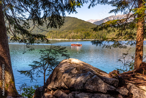 Motorboat on Lake Eibsee at the Zugspitze in summer
