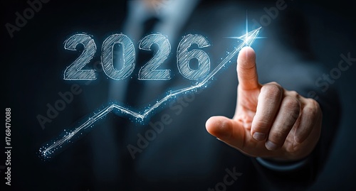 Year 2026 growth graph with upward arrow touched by finger