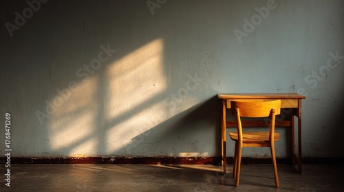 melancholy. Single desk in corner of empty classroom with soft natural light. wellbeing guides, coaching materials, designed for mental health education and mindfulness programs.