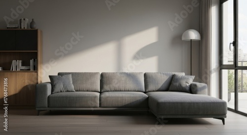 Bright living room grey sofa, wood cabinet, floor lamp, natural light