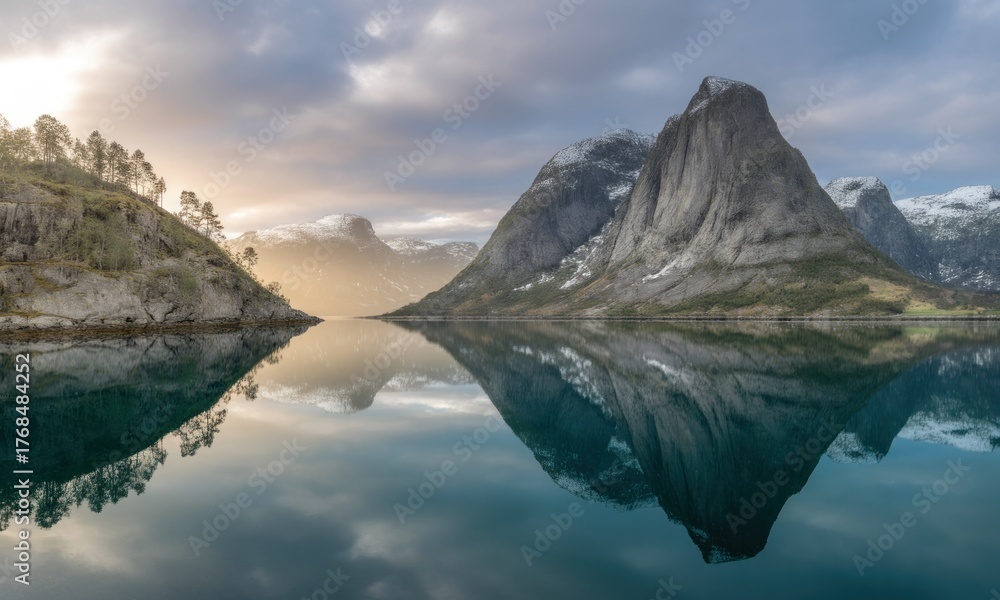 Obraz premium Serene fjord landscape at sunrise. Misty mountains reflected in