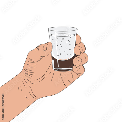 Close up of a hand holding a layered shot glass with brown liquid and bubbles.