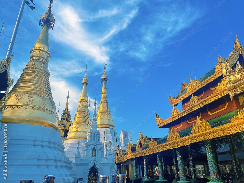 Naklejka premium Shwedagon Pagoda in Yangon Myanmar, Famous Golden Buddhist Temple Landmark with Blue Sky
