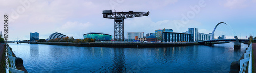 Glasgow City Skyline Panorama at sunrise with Clyde Arc Squinty Bridge and Bells Bridge over the River Clyde in Scotland, United Kingdom.