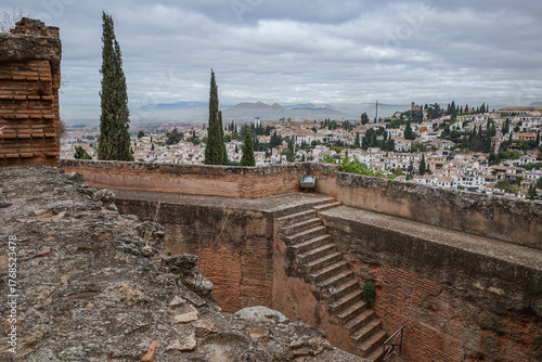 Granada, Spain - 21 Oct 2025: View of Granada cityscape from the Alcazaba, fortress towers and outer walls of Alhambra
