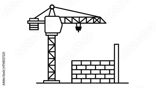Construction crane and brick wall on
