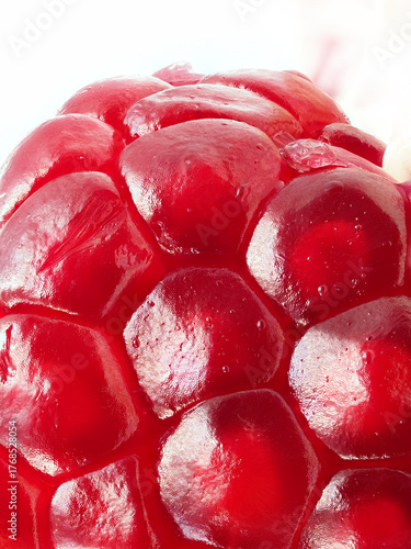Bright red pomegranate seeds captured in detail showcasing their unique texture and rich color