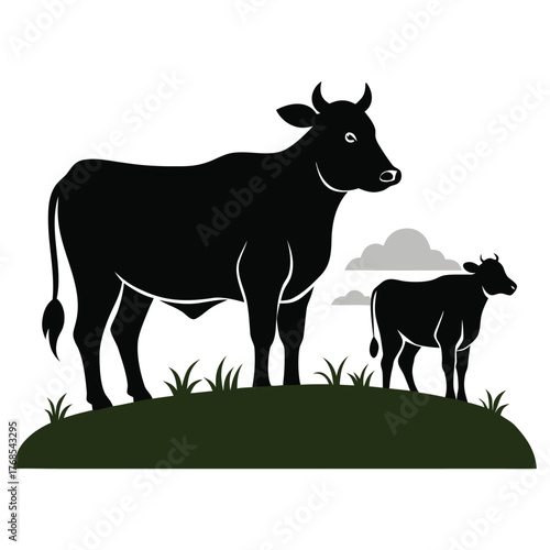 Cattle grazing on the grass field silhouette
