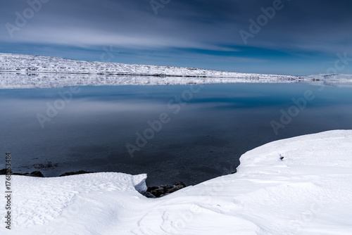 Winter Landscape with Snow-Covered Lake