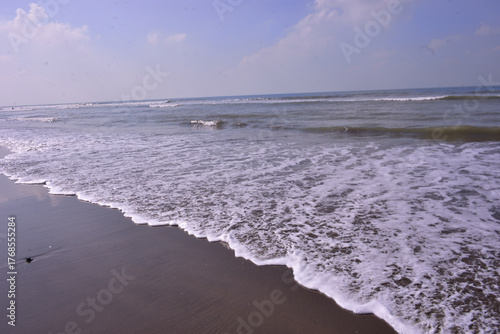 Slika na platnu Expansive seascape of Cox's Bazar beach on the Bay of Bengal in Bangladesh, with a vast blue sky and gentle waves