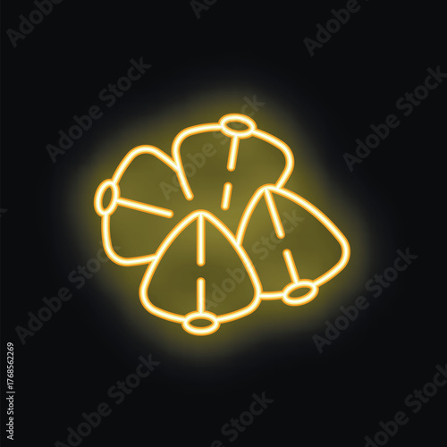 Bright yellow neon sign of a flower is glowing on a black background