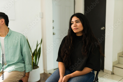 Woman feeling sad during support group session