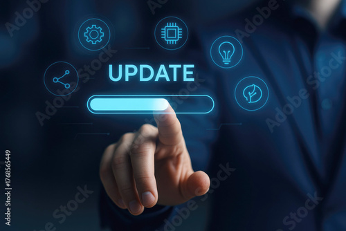 Hand touching update progress bar with technology icons on dark background digital software