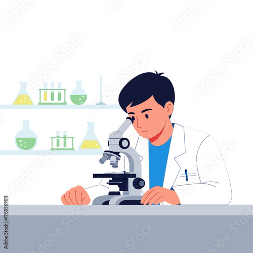 A young male scientist in a white lab coat intently looking through a microscope in a research laboratory.