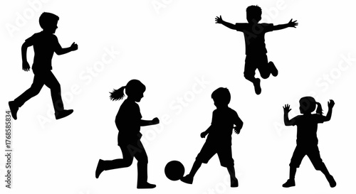 Silhouettes of children playing soccer running jumping and having fun in a playful and energetic manner