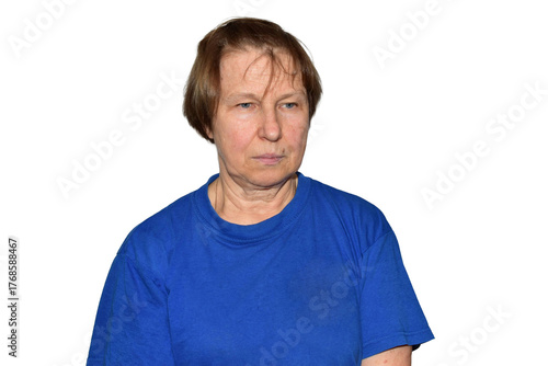 Portrait of a sad elderly woman in a blue T-shirt on a PNG background.