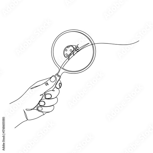 Hand holding magnifying glass with ladybug on a line  