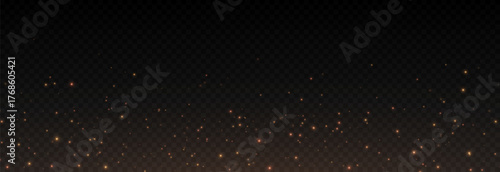 Golden glowing magic dust on a transparent background. Flying light particles PNG. Glowing dust PNG.