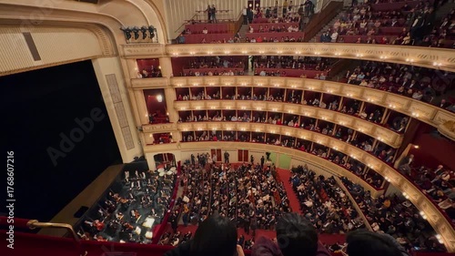 Exploring the majestic Vienna State Opera Clips showcase the opulent, gold-trimmed grand staircase, the historic exterior façade, and luxurious velvet theater boxes.