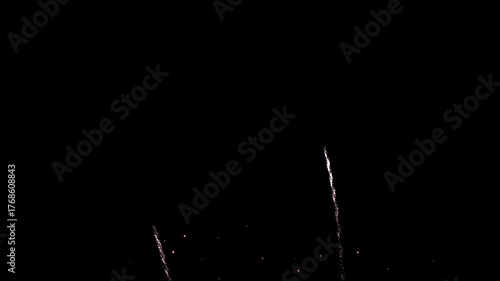 Bright colorful festive glowing fireworks on night sky.  New Year, Christmas, festival, party and holiday celebration concept