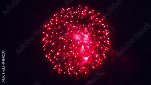 Bright colorful festive glowing fireworks on night sky.  New Year, Christmas, festival, party and holiday celebration concept