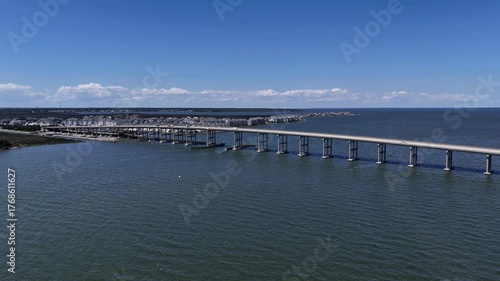 Wallpaper Mural Aerial View Of Washington Baum Bridge Over Calm Water of Roanoke Sound Connecting Roanoke Island to Nags Head on the Outer Banks. Bright blue sky, tranquil water, urban-seaside scene. Torontodigital.ca
