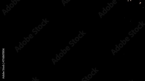 Bright colorful festive glowing fireworks on night sky.  New Year, Christmas, festival, party and holiday celebration concept