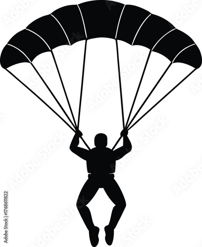Silhouette of skydiver with open parachute descending