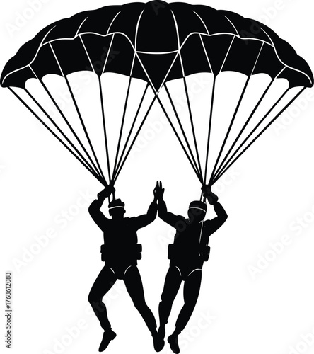 Two skydivers giving high five under parachute Keywords: skydiver, skydiving, parachute, tandem