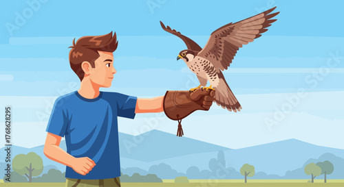 Young boy training a majestic falcon on his gloved hand.