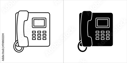 Set of two office telephones, one outlined and one solid black