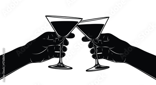 A celebratory toast with two martini glasses held in shadowy hands