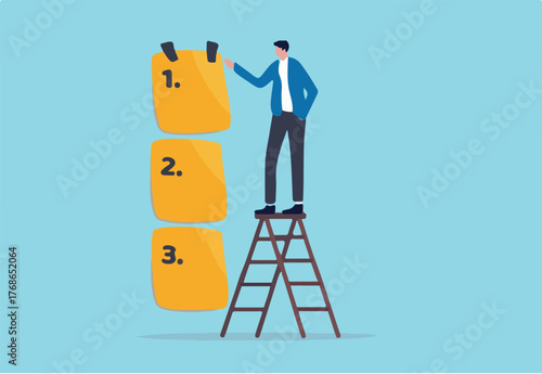 Set work priority, arrange to do list which job to do before and after, task management concept, young entrepreneur businessman manage to prioritize sticky note with number first, second and third.