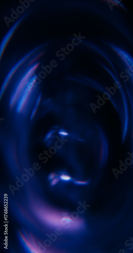 Blur dazzle swirl. Lens flare. Purple blue neon color optical rainbow twirl illuminated texture on abstract creative bokeh art background.