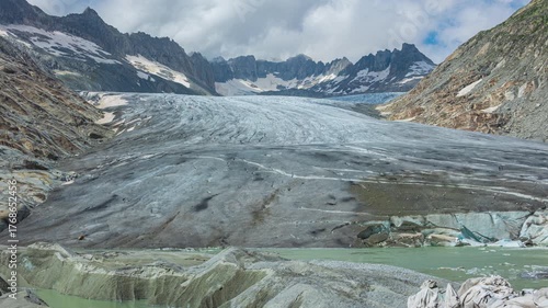 Time lapse, view of melting glacier in the Swiss Alps. Rhone Glacier, the source of the river Rhone. Furka Pass, Canton Valais, Switzerland