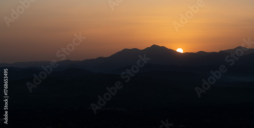 Wallpaper Mural Sunset behind the mountains of Crete with layered valleys and warm sky tones Torontodigital.ca