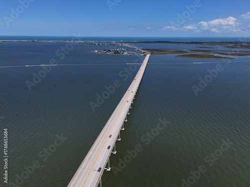 Wallpaper Mural Aerial View Of Washington Baum Bridge Over Calm Water of Roanoke Sound Connecting Roanoke Island to Nags Head on the Outer Banks. Bright blue sky, tranquil water, urban-seaside scene. Torontodigital.ca