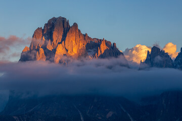 Foto auf Acrylglas Alpen sunset on Alpe di Siusi in the Italian Dolomites - the sun shines through the clouds on a rocky alpine peak  © Ladislav_Zemanek