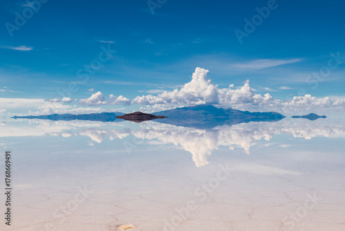 Reflection of island on uyuni salt flat
