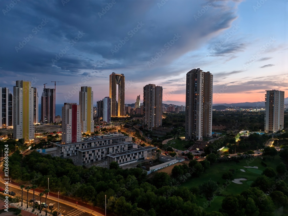 Obraz premium night cityscape view, calm night with illuminated skyline, silent city lights under evening sky
