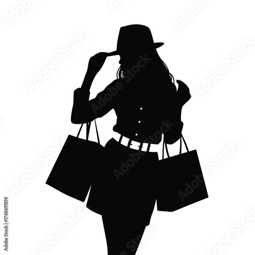 Silhouette of a fashionable woman carrying shopping bags and wearing a hat