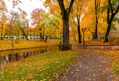 Late autumn in old city park, overcast day
