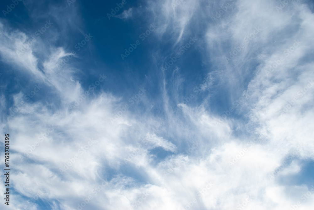 Obraz premium white clouds in a soft blue sky