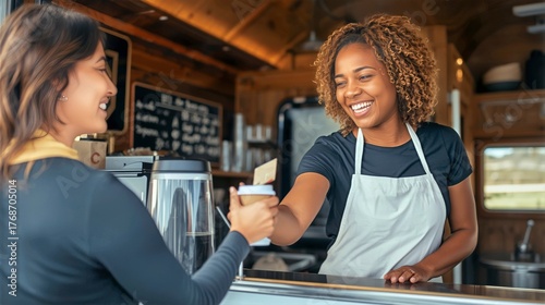 Barista Serving Coffee to a Customer at a Food Truck on a Sunny Day