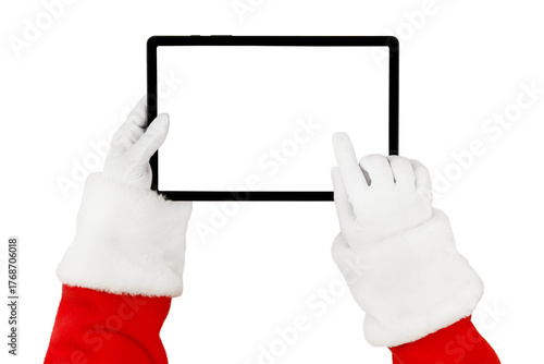 Christmas Santa Claus hand holding and pointing to white blank of tablet screen isolated on white background with clipping path. Design element.