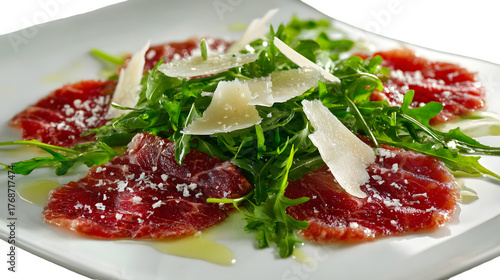 Savor the exquisite taste of thinly sliced cured meat with fresh arugula and shaved parmesan, a gourmet starter perfect for elegant dining and culinary inspiration.