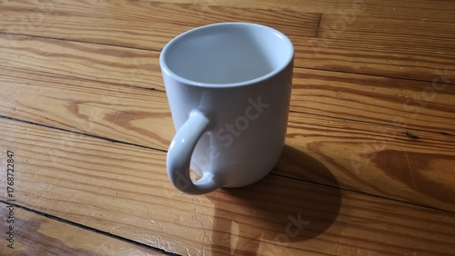 Fotografie Smartphone With Flower Wallpaper Beside White Mug On Wooden Table In Morning Hom