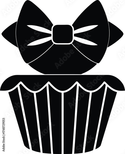 Cupcake with large bow decoration vector illustration. Black silhouette sweet dessert with elegant accessory on transparent background