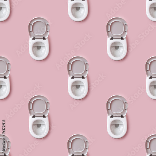 Repeating Pattern of White Toilet Bowls with Open Lids on Pink Background